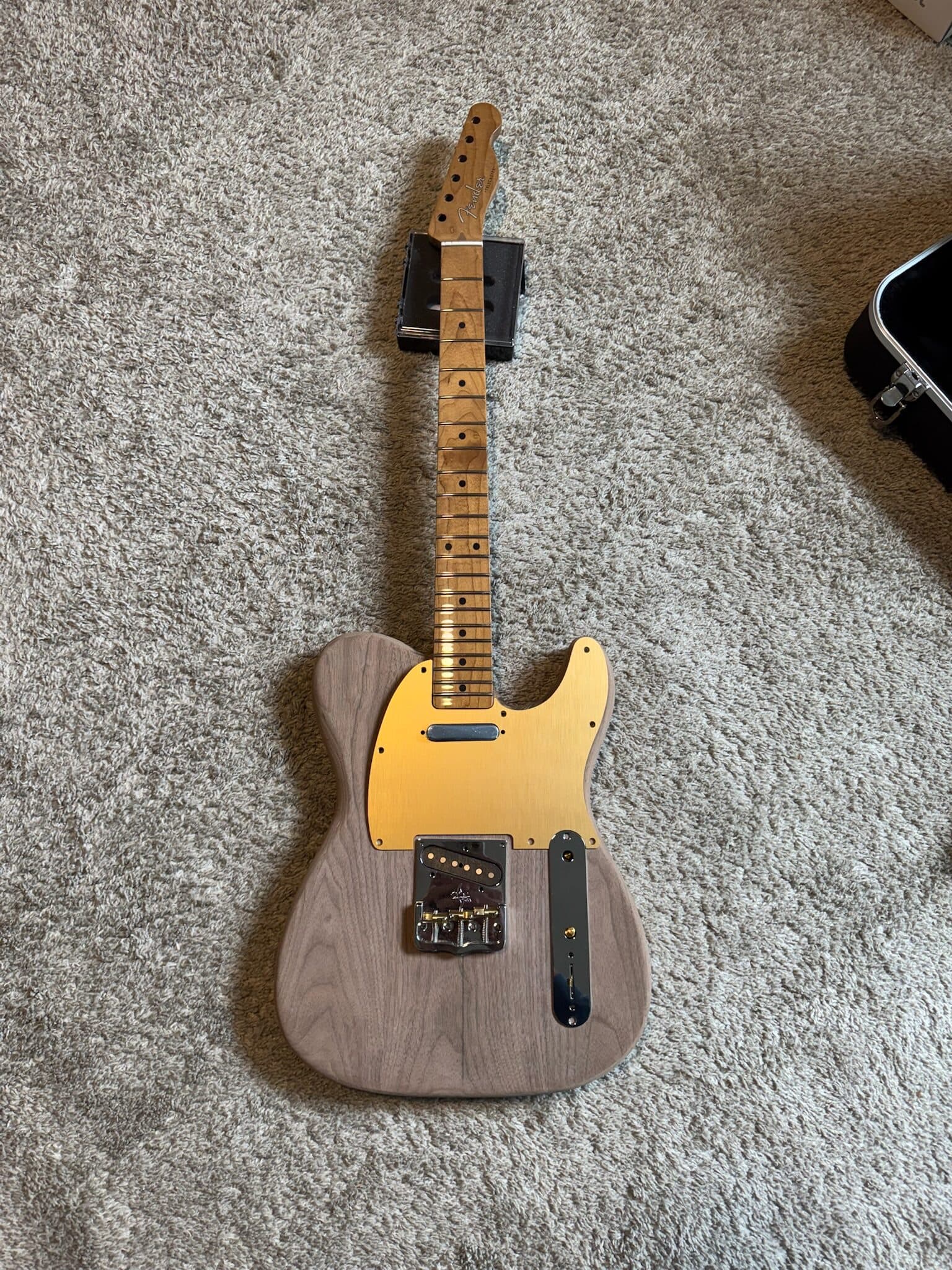 Assembled Telecaster with mirrored pickguard and gold hardware
