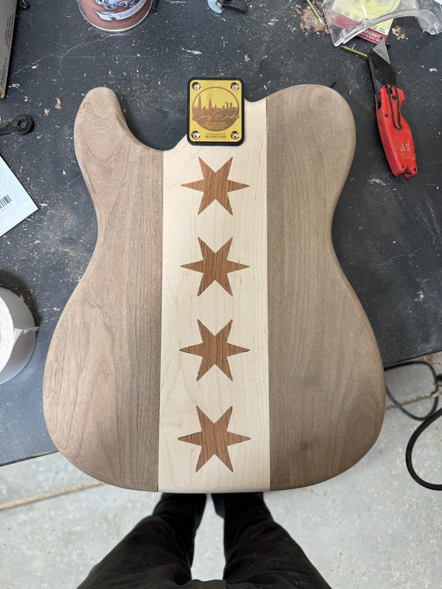 Completed maple stripe and four-star inlay on the guitar back