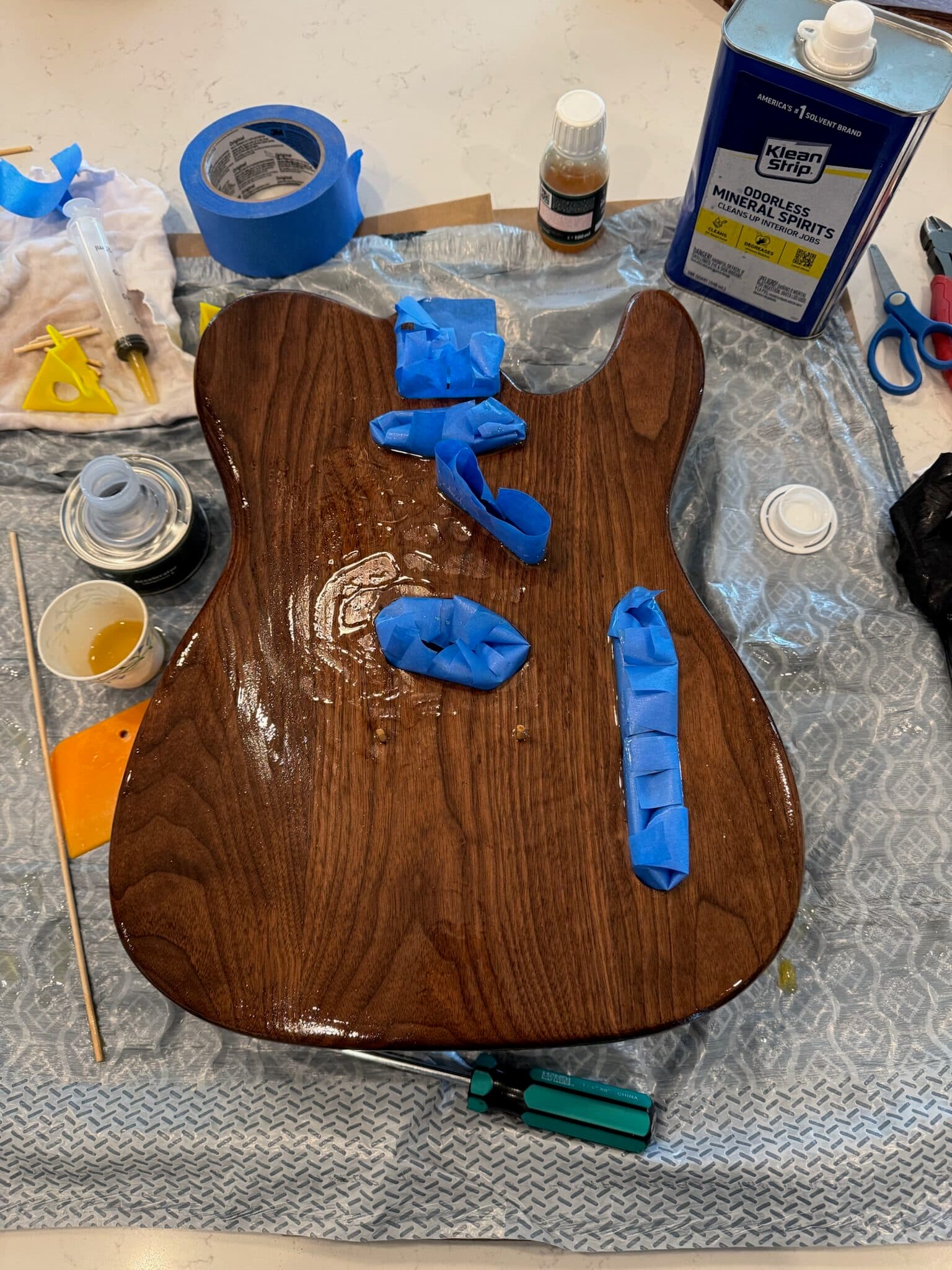 Applying oil finish to the walnut Telecaster body
