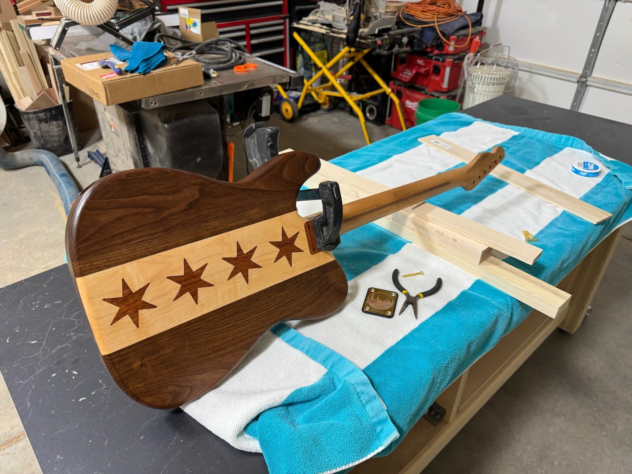 Assembling the finished guitar body and gold hardware